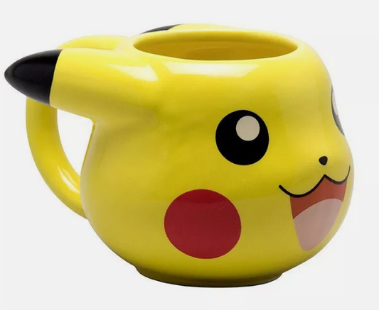 (Side View of Pikachu Mug): "Image of a ceramic mug shaped like Pikachu's head from the Pokémon series. The mug is bright yellow with black-tipped ears, and it features Pikachu's iconic facial expression with large black eyes, red cheeks, and a smiling mouth. The handle is attached at the back of the head.