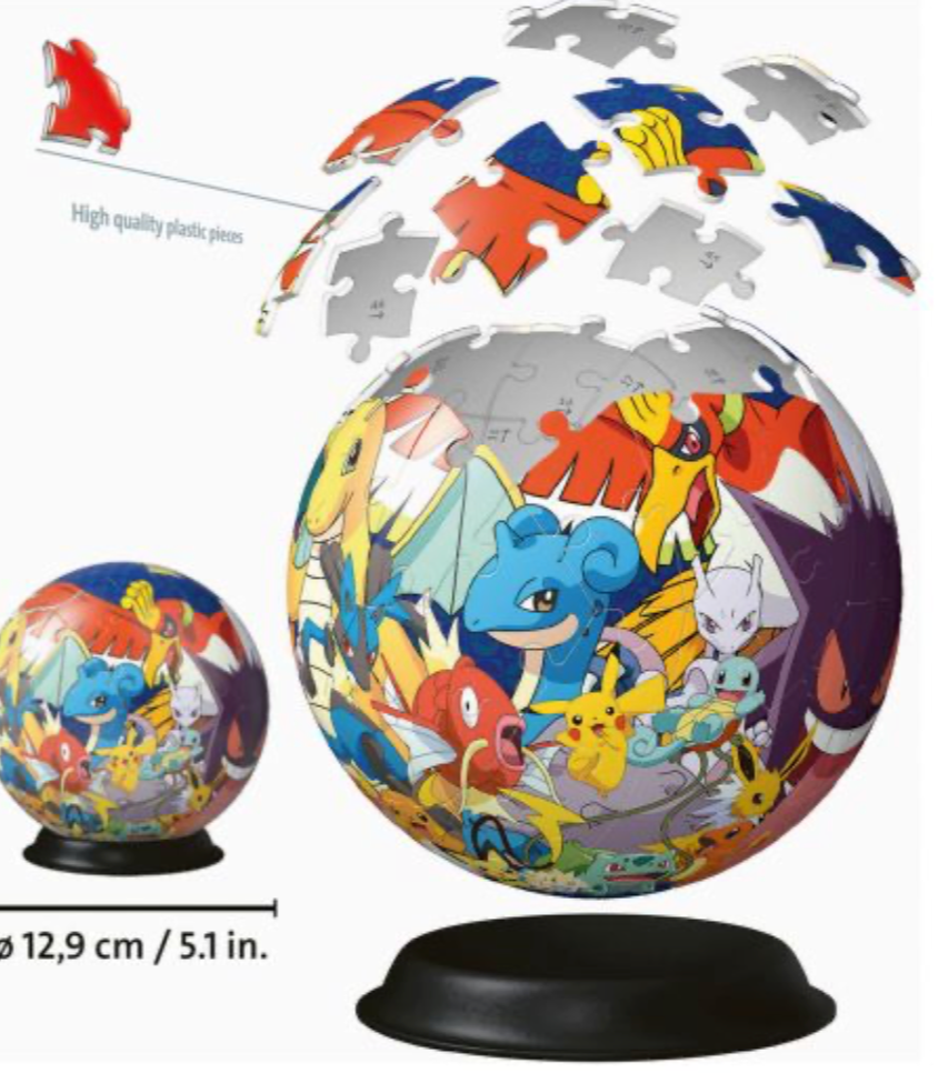 Illustration showing an exploded view of the Pokémon 3D puzzle sphere with some pieces lifted off, revealing the interior structure. The sphere features various Pokémon characters, including Charizard, Lapras, Pikachu, Mewtwo, and others, on its surface. A measurement is provided next to the sphere, indicating its size as 12.9 cm (5.1 inches) in diameter. The illustration emphasizes the high-quality plastic pieces used to construct the puzzle.
